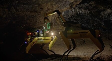 Industrial spot robot working in a cave