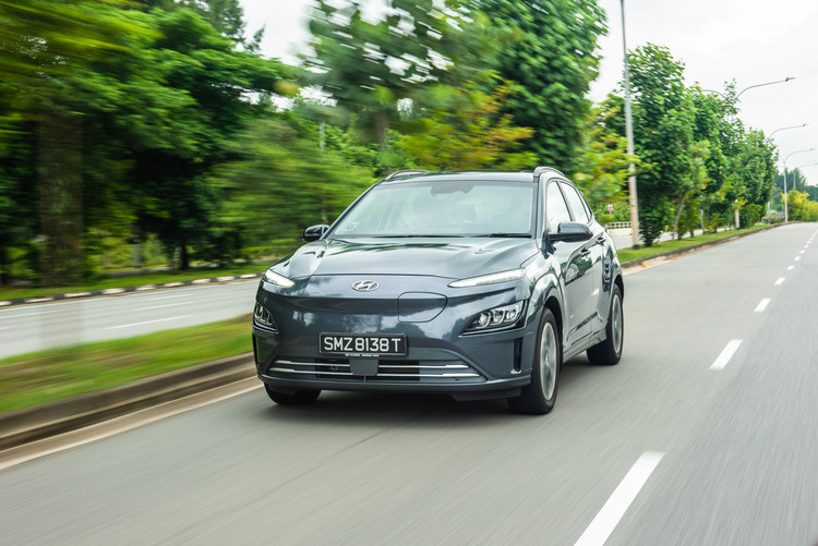 Hyundai KONA Electric driving down the road